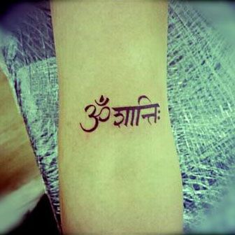 'Om Shanti' Tattoo  Om Shanti is an invocation of peace Om Shanti Tattoo Sanskrit, Om Shanti Tattoo, Shanti Tattoo, Om Tattoo Meaning, Namaste Tattoo, Buddhist Symbol Tattoos, Tattoo Yoga, Hindu Tattoos, Yoga Tattoos