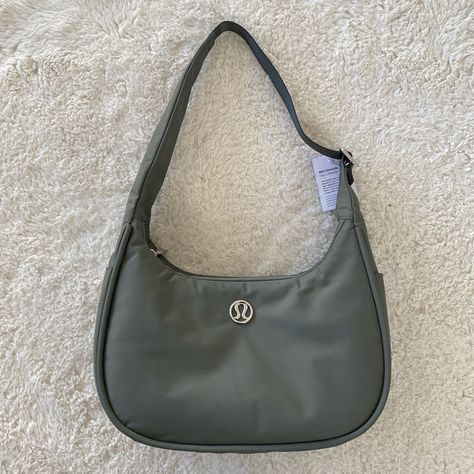 Lululemon Mini Shoulder Bag 4l Grey Sage Nwt Water-Repellent 100% Of The Nylon In This Product Is Recycled (Excluding Trims) Bag Dimensions: 29cm X 12cm X 17.5cm (11.4" X 4.7" X 6.9") Strap Length When Fully Extended: 32cm (12.6”) Volume: 4l Adjustable Shoulder Strap For Comfortable Carrying Exterior Zippered Pocket To Secure Your Valuables Side Drop-In Pockets Zippered Main Compartment Interior Pockets Hold The Essentials Mesh: 100% Recycled Polyester Lining: 100% Recycled Polyester Body: 100% Lululemon Mini Shoulder Bag, Lululemon Shoulder Bag, Free Tote, Makeup Bag Organization, Festival Bag, Yoga Bag, Mini Shoulder Bag, Black Tote, Bag Handle