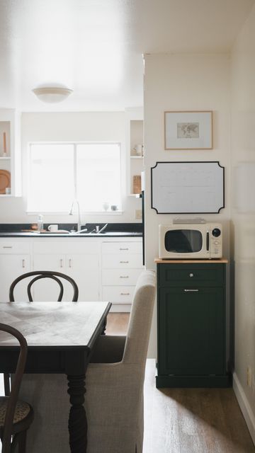 rachel bell on Instagram: "i’ve noticed a couple trends in homes over the last few years: no one wants you to see their trash + no one wants you to see their microwave 😂 but when i couldn’t come up with a solution that hid these things well in our apartment, i created a solution where they could be seen + still be an attractive part of our kitchen instead of an eyesore! this is my favorite part about renting. it forces me to think outside the box + come up with solutions i can’t easily find any Hide A Trash Can Kitchen, Diy Hidden Trash Can Kitchen, Microwave Solutions Small Kitchen, Hidden Trash Can Kitchen, Couple Trends, Rachel Bell, Hide Trash Cans, Microwave Cabinet, Microwave Stand