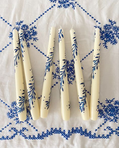 Blue and white embroidered tablecloth with blue and white hand painted candles