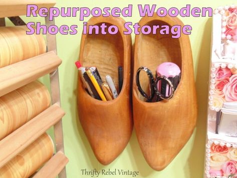 Fun storage hack using upcycled wooden shoes. Now I don't expect that you can just go out and find a pair of wooden shoes to hang on your wall, but look through your own stuff and see what unusual things you might be able to repurpose as cool storage.   You might just be surprised by what you can come up with. Dutch Wooden Shoes, Picture Frame Hangers, Old Drawers, Wood Shoes, Kitchen Storage Containers, Craft Room Storage, Vintage Silverware, Muffin Tins, Wooden Shoes