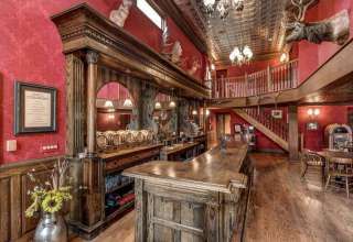 this-amazing-dream-house-comes-with-its-own-old-west-saloon-20170802-129 Italian Rustic Kitchen, Old West Decor, Rustic Italian Decor, Rustic Italian Home, Saloon Decor, Old West Saloon, Western Saloon, Small Kitchen Storage, Tuscan Kitchen