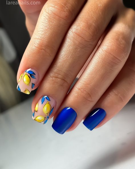 Brighten up your summer look with a blue manicure 💙 inspired by the iconic Dolce & Gabbana lemon print. 🍋🍋🍋 This vibrant nail art combines the refreshing hues of Royal blues with the zesty yellow of lemons, capturing the essence of sunny days and citrus groves. @lareanetwork #dolcegabbana #larea #njnails #russianmanicurenj #lareanails #lareanailsnj #lemonprint #lemonnails Lemons Nail Art, Amalfi Coast Nails Ideas, Blue And Yellow Lemon Nails, Blue And Yellow Nail Art Designs, Summer Lemon Nails, Lemonade Nail Art, Lemon Inspired Nails, Dolce And Gabbana Nails, Italy Nail Art