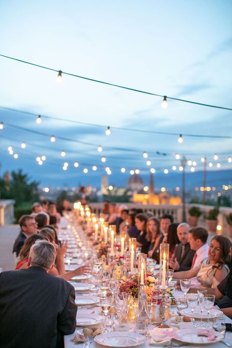 real wedding photo destination wedding in florence tuscany italy guests at candlelit dinner reception overlooking duomo bistro lights Dinner Lights, Candle Light Wedding, Candles Reception, 2026 Wedding, Romantic Fall Wedding, Dinner Reception, Florence Wedding, Inside Weddings, Wedding Greenery