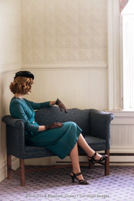 Elisabeth Ansley RETRO WOMAN IN HAT SITTING ON SOFA Women Sitting Pose Reference Couch, Sitting On Chair Reference, Women Headshots, Leg Reference, Looking Over Shoulder, Woman In Hat, Sitting Pose Reference, Royal Chair, Sitting Cross Legged