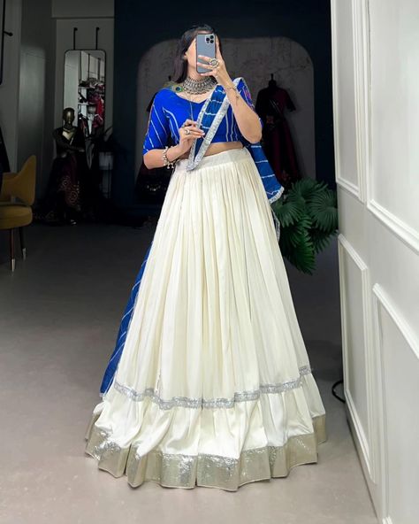 Rate : 1900 #apex__outfit Celebrate the festivities with flair in this plain white Navratri lehenga 🤍💙 Lehenga (Stitched) : Lehenga Fabric : Pure Rayon Lehenga Work : Plain With Embossed Design Gota Lace Border Lehenga Waist : Support Up To 42 Lehenga Closer : Drawstring With Zip Stitching : Stitched With Canvas And Full Inner Length : 41 Flair : 5.5 Meter Inner : Micro Cotton Blouse (Stitched) : Blouse Fabric : Pure Rayon (Fully Stitched) Blouse Work : Plain With Gamthi Patch Work And La... Garba Choli, Navratri 2024, Zip Stitching, Lehenga Stitched, Garba Outfit, White Lehenga, Navratri Dress, Cotton Lehenga, Lehenga Fabric