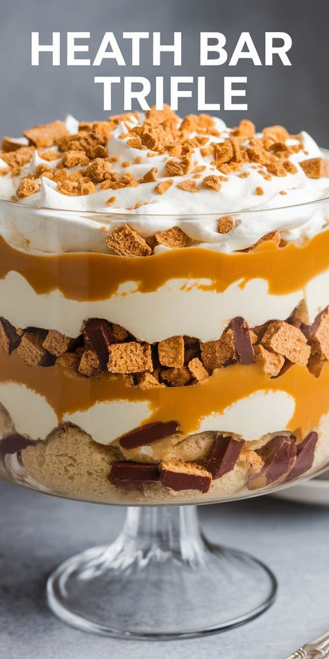 Bring joy to your dessert table with this Heath Bar Trifle! The combination of chocolate, cream, and crunchy candy creates a layered masterpiece that’s both beautiful and utterly delicious! Thanksgiving Dessert Trifle, Thanksgiving Trifle Desserts, Fall Trifle, Heath Bar Trifle, Easy Trifle Desserts, Holiday Trifle, Peanut Butter Banana Recipes, Punch Bowl Cake Recipe, Easy Trifle