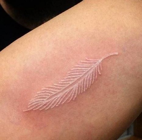 Top 9 Phenomenal White Tattoo Designs White Feather Tattoo, White Feather Tattoos, White Ink Tattoos, Cow Tattoo, Mother Nature Tattoos, Literary Tattoos, Ankle Tattoo Small, White Ink Tattoo, Feather Tattoo Design