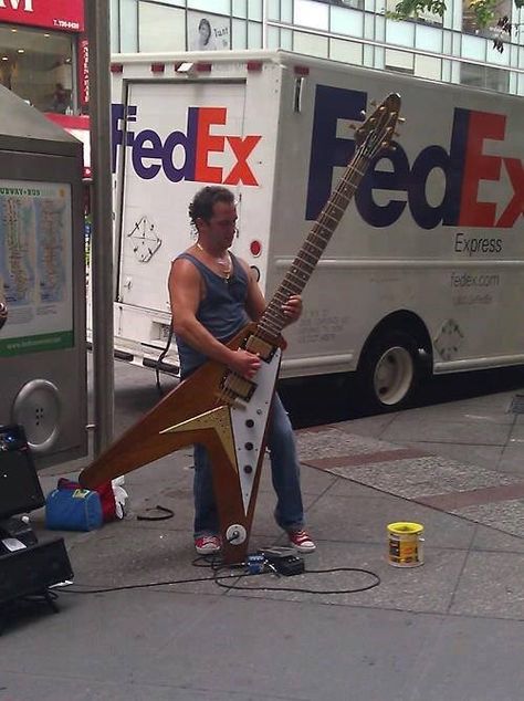 I'd hate to see the size of the guitar case! Then again, he could use the giant case to collect tips instead of the coffee can. Unknown Punster, Funny Guitar, Best Guitar Players, Learn To Play Guitar, Flying V, Guitar Tips, Guitar Solo, Guitar For Beginners, Guitar Art