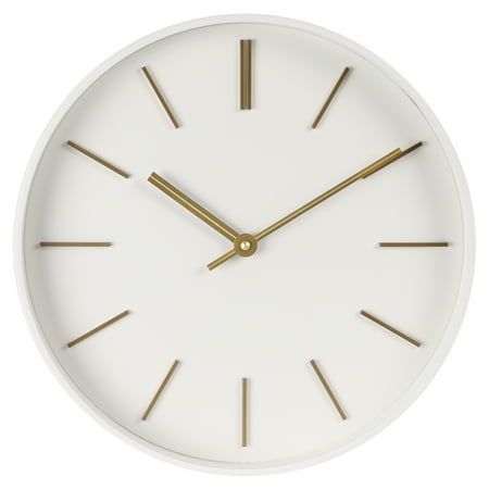 Looking for a way to add a touch of chic elegance to your home? Look no further than the 20in Better Homes and Gardens Modern White Wall Clock! With its modern and minimalist design, this clock is not only a functional timepiece but also a stylish design statement that will elevate any room. Encased in a sleek white frame, its aesthetically pleasing profile strikes the perfect balance with the dials dimensional warm brass hour markers and coordinating warm brass handset. The glass lens protects White Wall Clock, White Wall Clocks, Clock Shop, Better Homes And Garden, Design Statement, Large Wall Clock, Large Clock, Homes And Gardens, Wall Ideas