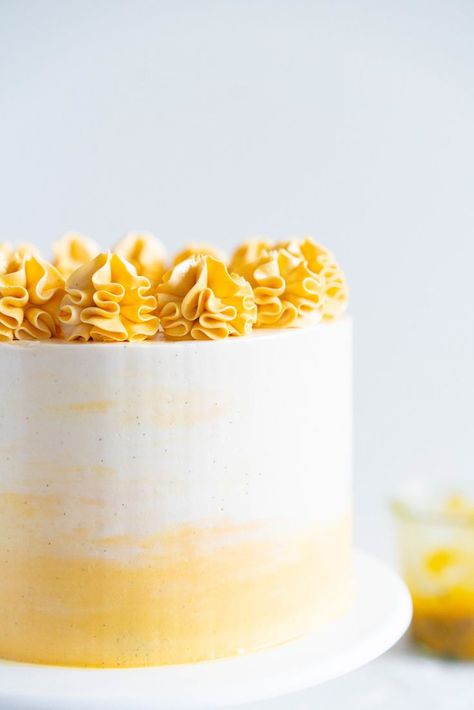 Vanilla Layer Cake with Passionfruit Curd and Vanilla Swiss Meringue Buttercream. Perfect for any occasion - layers of vanilla cake are sandwiched with a silky vanilla bean swiss meringue buttercream, and filled with a tangy, creamy passionfruit curd. #layercake #passionfruitcake Vanilla Layer Cake, Passionfruit Curd, Passion Fruit Cake, Layer Cake Filling, Vanilla Bean Cakes, Mini Torte, Meringue Buttercream, Swiss Meringue Buttercream, Swiss Meringue