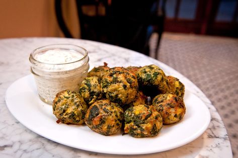 At Sips & Bites we love to tweak a classic. This is a riff on a favorite game day snack — spinach artichoke dip. When we cater events, we find it's more special if everything is made in individual servings. This is much cleaner and better-looking than a big communal bowl of dip, but has the same familiar homey taste. Artichoke Balls, Spinach Balls, Dill Sauce, Game Day Snacks, Spinach Artichoke Dip, Dumpling Recipe, Creamed Spinach, Spinach Artichoke, Balls Recipe