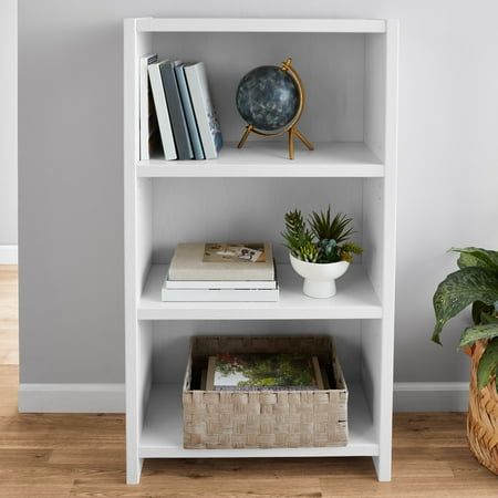 Transform your living space with our 3-shelf bookcase from the Mainstays Westley collection, designed to bring order and style to your home. This attractive white bookshelf boasts three generously sized shelves, providing ample space for organizing and showcasing a diverse range of items, from storage bins and book collections to decorative plants or knick-knacks. The flexibility of this small bookcase is enhanced by two adjustable shelves, allowing you to accommodate items of varying shapes and Short Bookshelf Decor, White Shelf Ideas, White Bookshelf Aesthetic, Bookshelf White Aesthetic, Short White Bookshelf, White Small Bookshelf, White Narrow Bookshelf, Mainstays Bookcase, Small Book Shelf