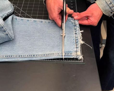 Find out how to give your favorite pair of a jeans a raw hem. Check out this frayed hem jeans DIY tutorial for super easy step-by-step instructions. Distressing Jean Hems Diy, Raw Edge Hem Jeans Diy, How To Distress Jean Hems, How To Raw Hem Your Jeans, Raw Edge Jeans Diy, How To Size Down Jeans, How To Shrink Jeans Permanently, How To Raw Hem Jeans, How To Distress Jeans Hem