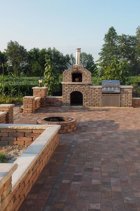 The project is a backyard paver patio with a wood fired pizza oven and built-in Duro® gas grill. The patio also has a wood fire pit and surrounding block walls. The patio is approximately 600 square feet. I also built stone steps from the French doors to the patio. I have wanted to build a pizza oven and patio for some time. Grill Area Pavers, Square Pizza Oven, Patio Pizza Oven, Build A Pizza Oven, Outdoor Patio Ideas Backyards, Fire Pit Pizza, Square Pizza, Brick Paver Patio, Pavers Backyard