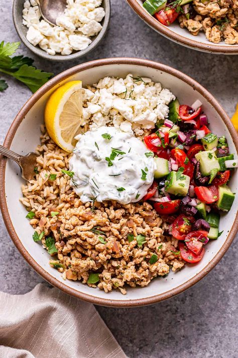 Greek Chicken Bowls are packed with Greek flavor! Spiced ground chicken, a cucumber tomato salad and tzatziki sauce all on top of lemon dill rice. Lemon Dill Rice, Greek Chicken Bowls, Dill Rice, Greek Rice, Dill Chicken, Greek Orzo Salad, Mediterranean Bowls, Greek Chicken Recipes, Chicken Bowls