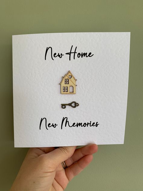 Handmade New Home, New Memories card, with a little wooden house and small key. A beautiful card using 6 x 6 white hammered card, blank inside, comes with white envelope.  If you would like a custom or personalised card with names or an address on the front or even typing inside and posting direct to the new address please send details when ordering. Or contact us before placing the order.  The card will be posted in a brown hardback envelope so it arrives to you safely. New House Cards Handmade, Cards New Home, New Home Card Messages, New Home Button Cards, New House Greeting Card, New House Watercolour Card, New House Card, Card House, House Card