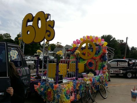 60's theme parade float complete with to 60's bicycles Woodstock Parade Float, Decades Float Ideas, 60s Homecoming Theme, Decades Homecoming Float, 70s Float Parade, Glastonbury Party, Hoco Floats, Parade Float Theme, Decades Day Spirit Week