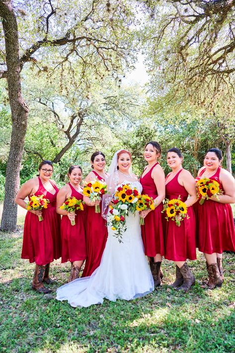 Red bridesmaid dresses, Boots, Ivory lace wedding dress and tons of sunflowers. Sun Flower Wedding Theme Bridesmaid Dresses, Bridesmaid Dresses Sunflower Theme, Burgandy Bridesmaids Dresses With Boots, Sunflower Wedding Bridesmaid Dresses Yellow, Barn Wedding Bridesmaid Dresses Cowboy Boots, Country Wedding Bride, Bride Maids, Country Bridesmaid Dresses, Ivory Lace Wedding Dress