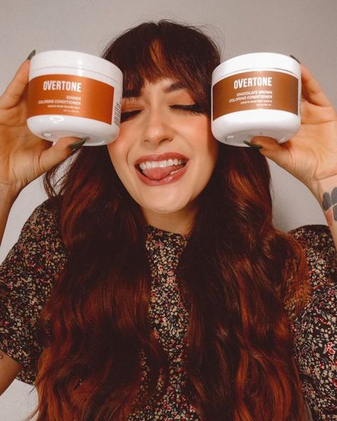 oVertone on Instagram: "When we saw @thelauragaskin s gorgeous blend of Chocolate Brown and Ginger conditioners over her brown and ginger balayage the endorphins HIT. Total custom color GENIUS. - Image Description: A person with bangs and long wavy styled hair holds up two jars of oVertone coloring conditioner and sticks out her tongue. - #overtonecolor #fallhair #diyhair #haircolorideas #haircolortrends #redhair #orangehair #brownhair #gingerhair" Overtone Ginger On Brown Hair, Wavy Styled Hair, Overtone Ginger, Ginger Balayage, Box Dye, Styled Hair, Image Description, Orange Hair, Ginger Hair