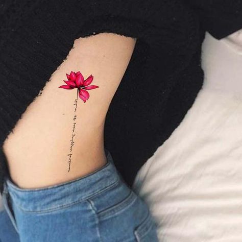 Spontaneous Tattoo, Lily Tattoo Meaning, Flower Tattoo On Ribs, Small Lotus Flower Tattoo, Tattoos On Side Ribs, Lily Tattoo Design, Flower Tattoo On Side, Lily Flower Tattoos, Rib Tattoos For Women