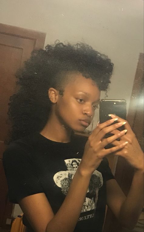 Girl with natural hair mohawk shaved sides Girl With Black Mohawk, Faux Locs Mullet, Punk Black Hairstyle, Braid Mullet Black Women, Black Alternative Hairstyles, Punk Hairstyles Black Women, Mullet Haircut Black Women, Afro Mullet 4c Hair, Alternative Hairstyles Black Women