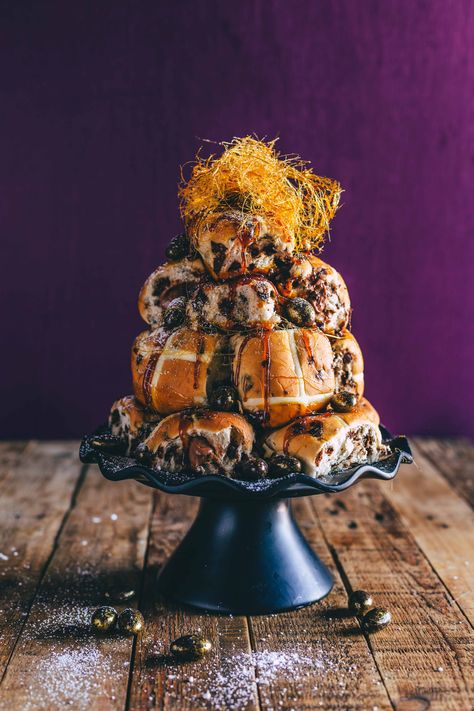 A tower of chocolate-filled hot cross buns decorated with spun sugar Croquembouche Tower, Easy Hot Cross Buns Recipe, Easy Hot Cross Buns, Hot Cross Buns Recipe Easy, Easter Sweet Treats, Guacamole Chicken, Cross Buns Recipe, Sticky Buns Recipes, Hot Cross Buns Recipe