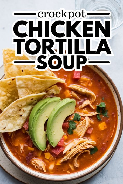 Bowl of chicken tortilla soup topped with avocado slices and tortilla chips. Slow Cooker Chicken Recipes Healthy Easy, Crockpot Chicken Tortilla Soup Easy, Dairy Free Chicken Tortilla Soup, Crockpot Soup Chicken, Easy Chicken Tortilla Soup Crock Pot, Chicken Tortilla Soup Crockpot, Crockpot Tortilla Soup, Soup In Crockpot, Soup Crockpot Recipes