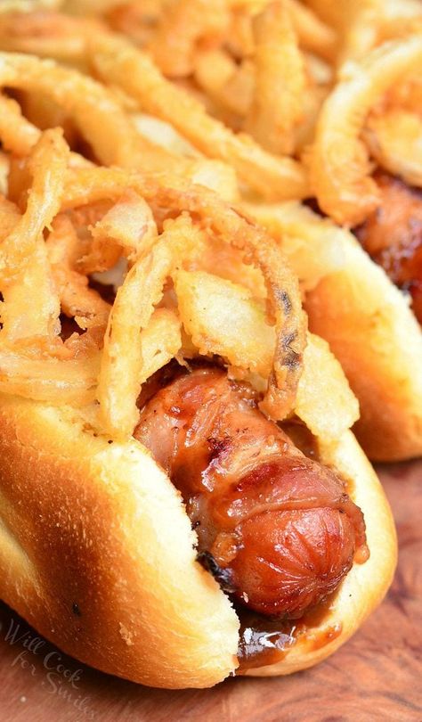 Bacon Wrapped BBQ Hot Dogs are tossed in BBQ sauce, wrapped in bacon, and grilled to smoky perfection. To make it even better, they are topped with crispy fried onions. #hotdog #grilling #bacon #friedonions Will Cook For Smiles, Hot Dogs Recipes, Gourmet Hot Dogs, Burger Dogs, Bbq Bacon, Hot Dog Recipes, Crispy Onions, Chapati, Dog Recipes