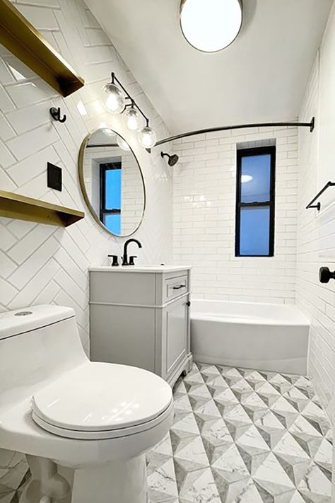 See how a total demo rescues this bathroom that had been untouched for years. Now, it’ll last for years to come. Dated Apartment, Gold Shelves, Apartment Projects, Striped Shower Curtains, Glass Partition, White Subway Tile, Marble Look Tile, Floral Shower Curtains, Room Transformation