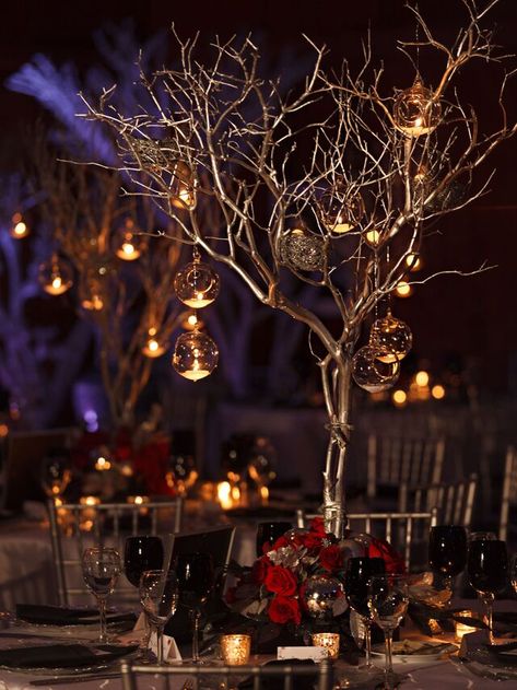 49 Winter Wedding Centerpieces That Celebrate the Season Tree Centrepiece Wedding, Floating Tea Candles, Winter Wonderland Wedding Centerpieces, Labyrinth Wedding, Tree Centrepiece, Tree Branch Centerpieces, Centrepiece Wedding, Christmas Wedding Centerpieces, Candlelit Wedding