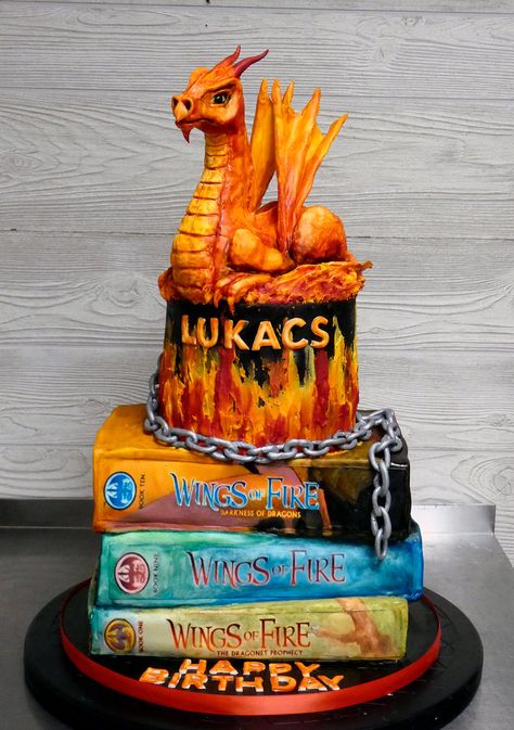 Only thing better than birthday cake is birthday cake with a dragon on it! Bottom two books were chocolate cake. Top book and top tier were vanilla cake. Dragon was sculpted from Rice Krispies Treats and covered with fondant, then painted. Chain and wings were made of gumpaste. Dragon Scale Cake Tutorial, Dragon Cake Tutorial, Wings Of Fire Cupcakes, Wings Of Fire Cakes, Wings Of Fire Cake Ideas, Wings Of Fire Birthday Cake, Wings Of Fire Birthday Party Ideas, Wings Of Fire Cake, Dragon Cake Pops