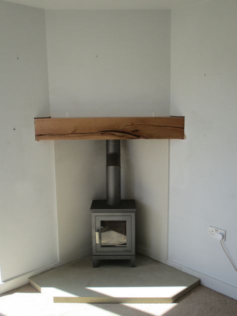 Wood Stove In Living Room Corner, Wood Burner Fireplace Corner, Stove Fireplace Ideas Corner, Wood Stove Set In Fireplace, Log Burner Extension, Corner Stove Fireplace Ideas, Tv Over Wood Burning Stove, Wood Burner In Kitchen, Corner Log Burner Living Rooms