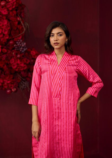 The Mystic Pink Kurta Set is crafted from the finest handwoven silk satin, combining luxurious texture with vibrant design. The kurta features a striking pattern of pink and scarlet stripes, creating a bold and contemporary look.Designed with a classic collar style and practical side pockets, this kurta effortlessly blends elegance with functionality. The rich silk satin fabric enhances the set’s overall sophistication, making it a versatile addition to your festive wardrobe.Colour: Pink/ Scarle Wardrobe Colour, Collar Kurta, Satin Shawl, Pink Kurta, Striped Shawl, Velvet Dress Designs, Silk Satin Fabric, Pant For Women, Pant Women