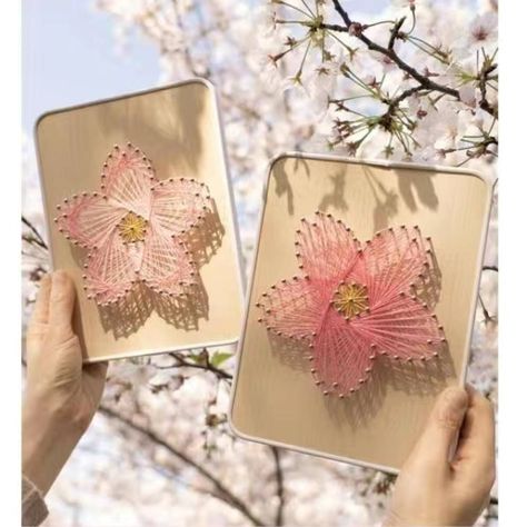 DIY nail string art sakura design  Dimensions: 15 x 20cm What is in the kit?  - Strings - Nail - Board - Tutorial video will be sent to you   Feel free to DM us for more information!   You can also find us on Instagram @knittingnitto! Nail Art On Wooden Board, Thread Art Diy, Wood Nail Art, String Art Flower, Diy Handmade Gift Ideas, String Nail Art, Hilograma Ideas, String Art Ideas, Nail And String Art