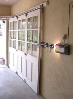 I love these sliding garage doors! To prevent blocking any ceiling room or  light. Pole Barn Kits, Sliding Garage Doors, Casa Garage, Barn Kits, Garage Remodel, Garage Conversion, Garage Makeover, Garage Shop, Garage Plans