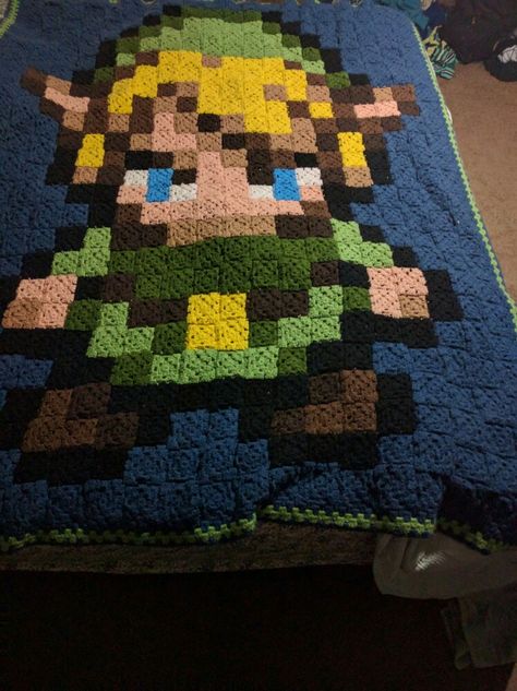 Link blanket - 8-bit granny square crochet Triforce Granny Square, Crochet Pokemon Granny Square, Cool Crochet Blanket, Crochet Zelda Blanket, Pokemon Granny Square Blanket, 8 Bit Crochet, 8 Bit Granny Square Blanket, Zelda Crochet Blanket Granny Squares, Nintendo Crochet