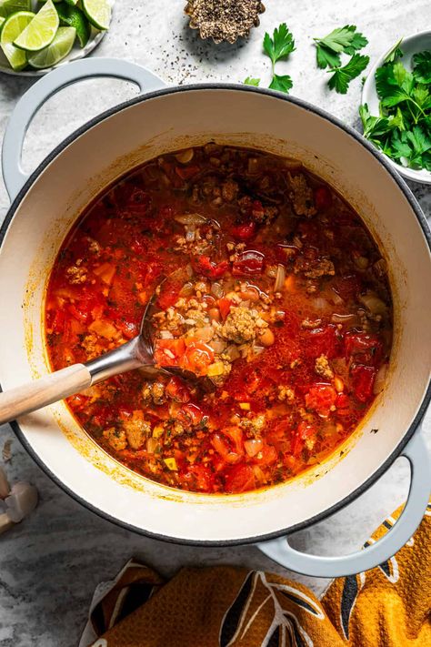 This spicy chorizo soup is a one-pot wonder filled with hearty beans and rice, tangy tomatoes and herbs, and juicy sausage in every bite. #chorizo #soup #easyrecipe Chorizo Rice, Chorizo Soup, Veggie Soup Recipes, Chorizo Tacos, Orzo Soup, Chorizo Sausage, Bean Soup Recipes, Best Soup Recipes, Beans And Rice