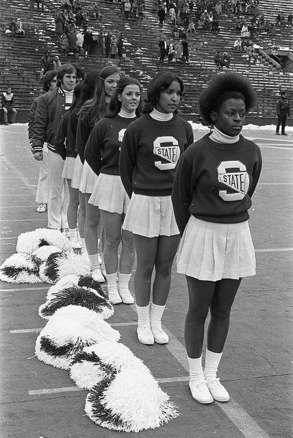 Cheerleaders at the MSU vs Northwestern football game, 1972 by Michigan State University Archives, via Flickr Cheerleader Outfits Aesthetic, 1920s Cheerleader, Vintage Cheer Uniform, Vintage Cheerleader Aesthetic, Vintage Cheerleader Uniform, Vintage University Aesthetic, School Spirit Aesthetic, 70s Cheerleader, Vintage Cheerleader