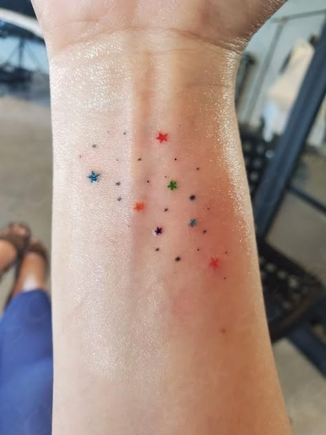 Tattoo Freckles Colorful, Colourful Star Tattoo, Teeny Tiny Tattoo Ideas, Confetti Tattoo Ideas, Pretty Color Tattoos, Star Tattoo Color, The Rest Is Confetti Tattoo, Simple Colorful Tattoos, Ellie Core Aesthetic