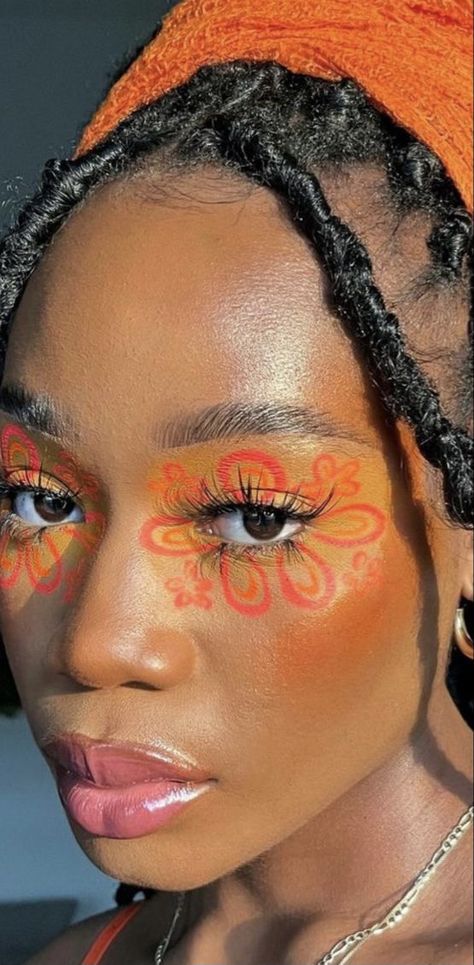 Orange Rave Makeup Looks, Orange Flower Makeup, Orange Graphic Liner, Graphic Liner Hooded Eyes, Graphic Eyeliner For Hooded Eyes, Flower Afro, Bambi Makeup, Tape Makeup, Radiant Makeup