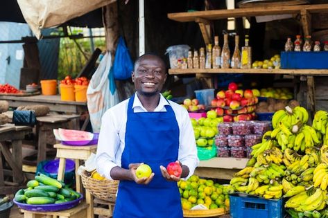 Young exciting fruits salesman standing ... | Premium Photo #Freepik #photo #vegetable-shop #vendor #fruit-store #african-business-man Vegetables Pictures, Fruits Background, Fruit Store, Fruits And Vegetables Pictures, Vegetable Pictures, Vegetable Shop, Colorful Fruit, Social Media Design Graphics, Design Graphics