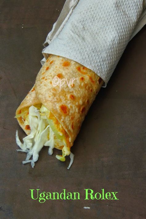 Rolex/ Ugandan RolledEggs ~~ Ugandan Cuisine. Fried tortilla, fried egg, shredded cabbage, Uganda Food, Uganda Recipe, Ugandan Food, Chapati Recipes, Kenyan Food, African Foods, Shredded Cabbage, Truck Business, African Cooking