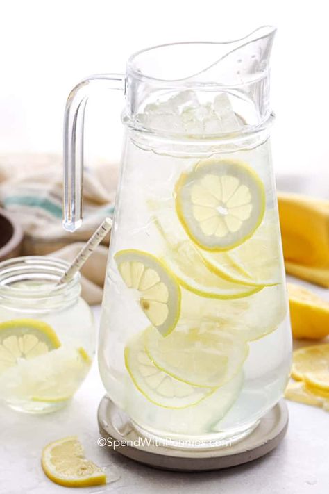 Lemon water is a fun and refreshing way to serve water. Try making a big pitcher with cucumbers, mints, or even orange slices for a flavorful twist. #spendwithpennies #lemonwater #flavoredwater #lemonwaterrecipe #beverage Lemon Water Recipe, Lemon Water Health Benefits, Boil Lemons, Lemon Juice Benefits, Water Health Benefits, Hot Lemon Water, Lemon Health Benefits, Lemon Uses, Drinking Hot Water