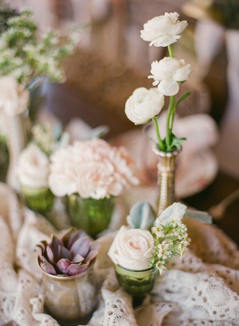 Just as you can go big and bold with your cluster centerpieces, you can also choose smaller, more delicate arrangements. Southern Elegance Design chose a mix of different bud vases and filled each with just a few stems, including roses, lamb's ear, ranunculus, and succulents. Peonies Wedding Centerpieces, Vintage Backyard Wedding, Classic Wedding Centerpieces, Vintage Backyard, Rose Centerpieces Wedding, Classic Wedding Flowers, Coral Charm Peony, Lush Wedding, Bottle Centerpieces