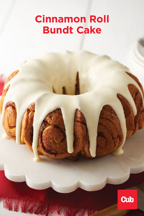 Cinnamon Roll Bundt Cake on a white platter. Canned Cinnamon Roll Bundt Cake, Bundt Pan Recipes Breakfast, Cinnamon Roll Bundt Cake Easy, Cinnamon Roll Bundt Cake, Cinnamon Bun Cake, Breakfast Bundt Cake, Bundt Pan Recipes, Easy Bundt Cake, Pillsbury Cinnamon Rolls