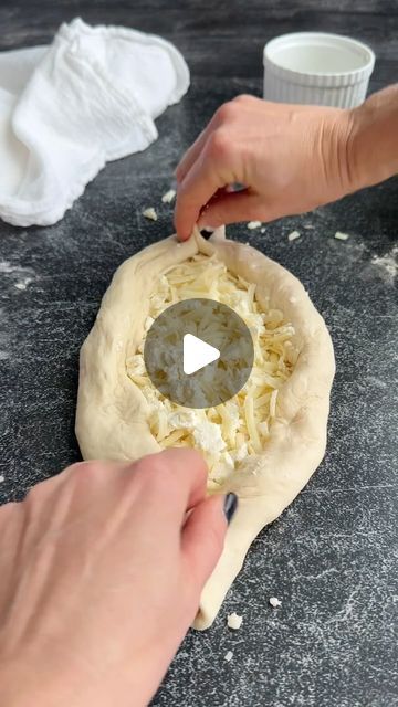 Natalya Syanova on Instagram: "Khachapuri (known as cheese boat in America) is a traditional Georgian dish, often considered a type of cheese-filled bread. The dough is shaped into a boat-like form and filled with a mixture of cheeses, eggs, and other ingredients. The most common types include Imeretian (cheese-only) and Adjarian (with a raw egg on top). This flavorful and comforting dish is popular in Georgian cuisine.

Making khachapuri (cheese boat) at home can be very easy, especially if you know how to work with the bread dough.

Recipe posted on my website, click➡️ @natashas_baking for the link.

#khachapuri #cheeseboat #recipe #baking #cheese" Georgian Cheese Bread, Natashas Baking, Khachapuri Recipe, Cheese Boat, Filled Bread, Bread Boats, Georgian Cuisine, Bread Dough Recipe, Recipe Baking