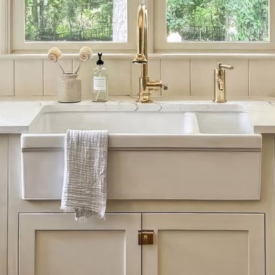 The farmhouse style has become a distinctive design statement not only for the kitchen or laundry room but also has taken center stage in specialty rooms such as workshops, artist's studios, and even greenhouses. These kitchen sinks are attractive, durable, stain-resistant, spacious, and available in a wide variety of styles and colors to suit any décor. Finish: White | Whitehaus Collection FarmhausQuatro 36" L x 20" W Double Basin Farmhouse / Apron Kitchen Sink Fireclay in Black / White | 10 H Kitchen Sink Black, Apron Kitchen Sink, Kitchen Sinks Farmhouse, Kitchen Faucets Pull Down, Apron Sink Kitchen, Farmhouse Apron, Apron Sink, Farmhouse Aprons, Fireclay Sink