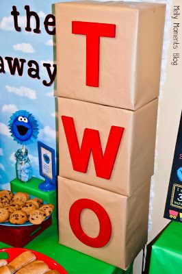 3D birthday boxes displayed at a Sesame Street / Elmo Themed Birthday Party for kids!  DIY decorations, free printables to download, and many festive party flare items at Melly Moments Blog!  Save time, energy, and money with these party planning ideas! Elmo Party Decorations, Elmo Birthday Party Boy, Cookie Monster Birthday, Elmo Birthday Party, Elmo Party, Sesame Street Birthday Party, Second Birthday Ideas, Sesame Street Party, Elmo Birthday