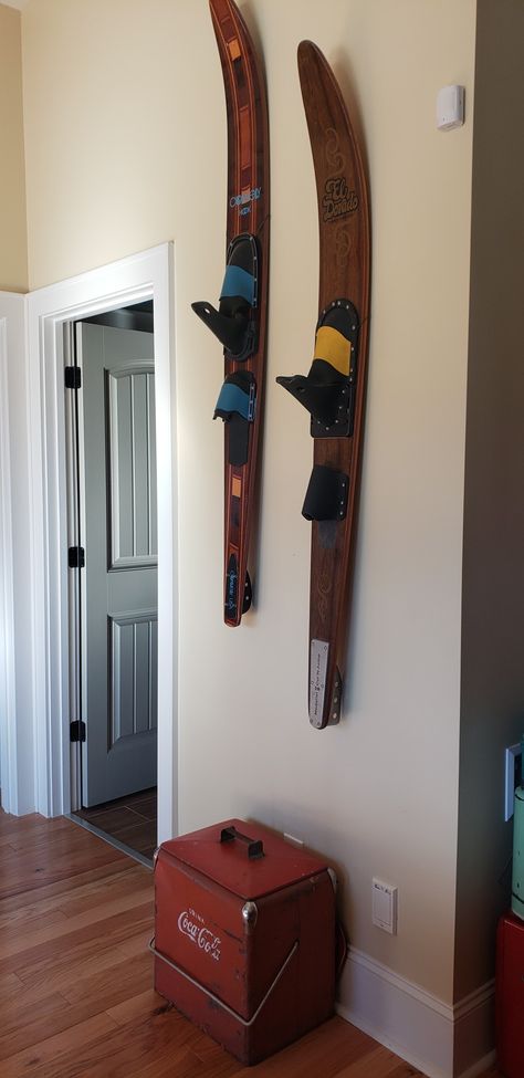 Hanging water sports equipment gives an interesting vibe to a lake house basement. Waterski Decor Ideas, Water Ski Decor Ideas, Water Ski Decor, Lake House Basement, Nautical Home Decorating, Vintage Cooler, House Basement, Lake Ideas, Ski Print